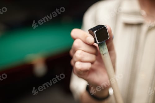 Preview: Holding Pool Cue With Tip Covered in Chalk Close-Up