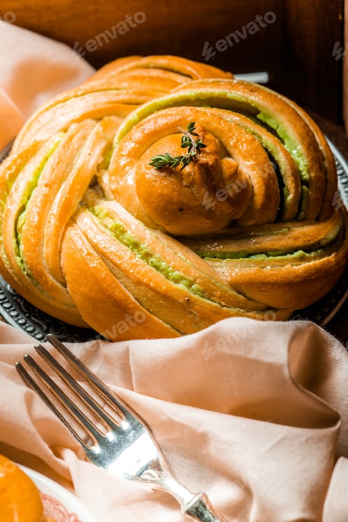 Preview: homemade buns with cream and pistachio cream decorated with thyme freshly baked for breakfast