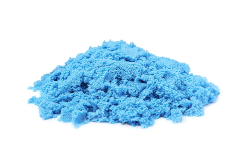 Preview: Pile of blue kinetic sand on white background