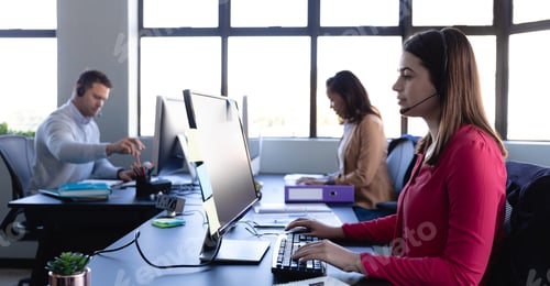 Preview: Business people working with headset phone in office