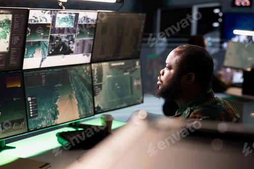 Preview: Army operative in command center analyzing surveillance data