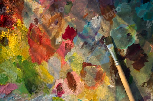 Preview: An artist's palette with an oil paint brush close-up