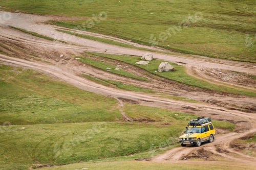 Preview: SUV Car On Off Road In Spring Mountains Landscape In Georgia. Dr