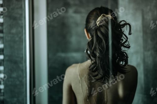 Preview: Adult woman having a shower, trying to figure out her emotions.