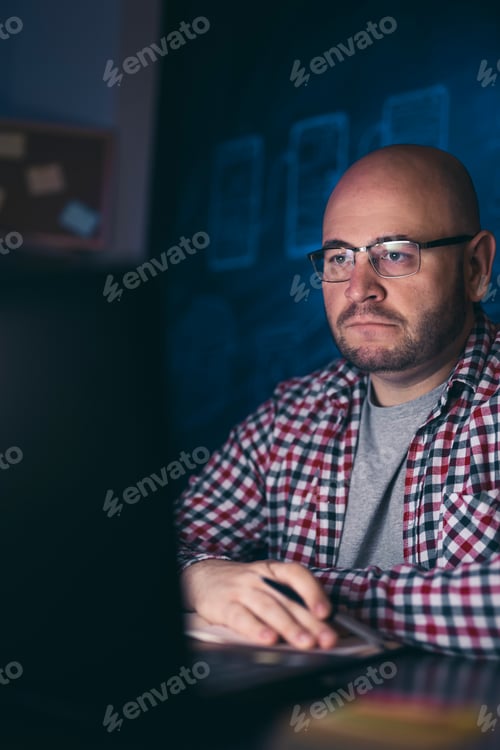 Preview: Man taking a late night online course