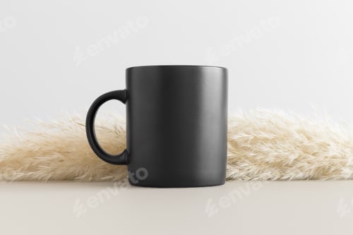 Preview: Black mug mockup with a pampas on a beige table.