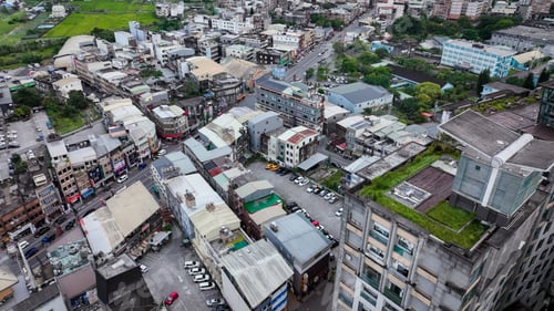 Preview: Daytime aerial view of Jiaoxi City showcasing urban structures and green spaces