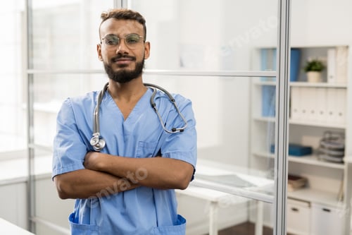 Confident Healthcare Professional Wearing Blue Scrubs and Stethoscope