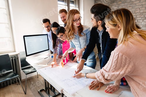 Preview: Group of architects working on project in modern office