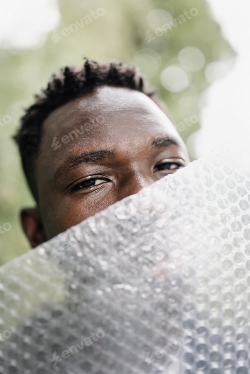Preview: Young African American man portrait. Plastic pollution, mental health concept