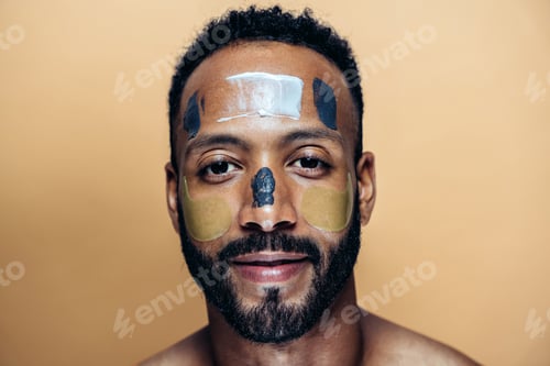 Preview: Image of a young man taking care of his skin