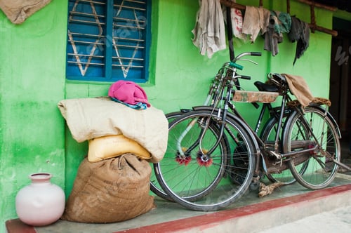 Preview: Bicycles and hessian sacks and rags outside village house near Mysore, Karnataka