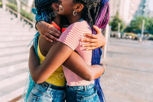 Preview: middle section two sisters outdoor hugging smiling