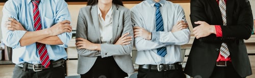 Preview: Panoramic banner image of a creative business team standing with arms crossed together in line