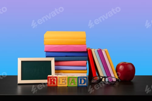 Preview: Stack of books on black wooden table