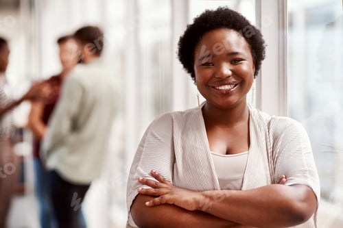 Preview: Portrait of a confident young businesswoman standing in an office