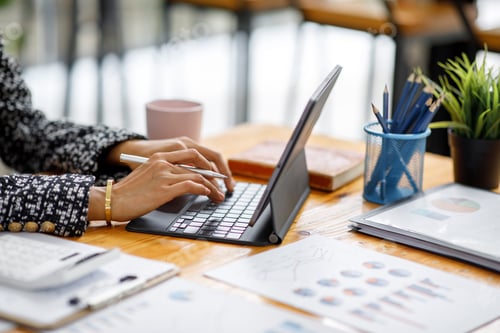 Preview: Asian Businesswoman Using laptop computer and working at office with calculator document on desk, do