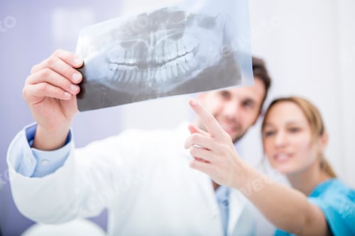 Preview: Two doctors discussing dental x-ray image