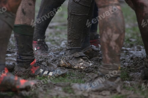 Preview: Closeup of dirty rugby players in the field