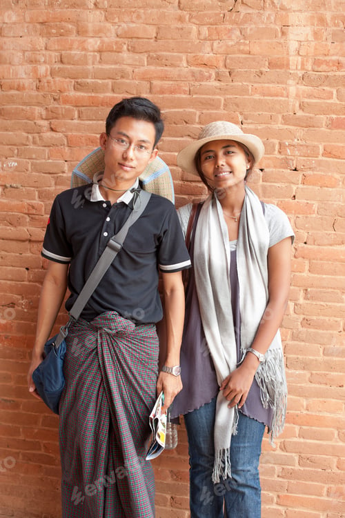 Preview: Portrait of young couple by brick wall, Bagan, Burma