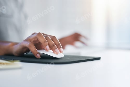 Preview: Closeup shot of an unrecognizable woman using a computer mouse in an office