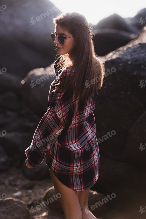 Preview: young slim beautiful woman on sunset beach, playful, dancing, bohemian outfit, indie style