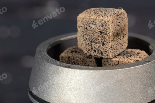 Preview: Burning hookah coals in hookah bowl close up