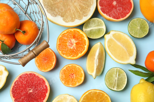 Preview: Different citrus fruits on color background, top view