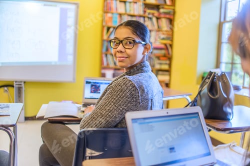 Preview: Portrait of female mature student looking over her shoulder in class