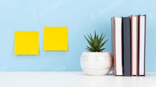 Preview: Office desk with yellow stickers, potted plant and notepads. Work from home