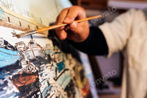 Preview: Close up of man artist painting oils in his studio.