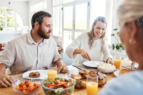 Preview: Food, family and couple eating at a table, happy, relax and bonding in their home together. Lunch,