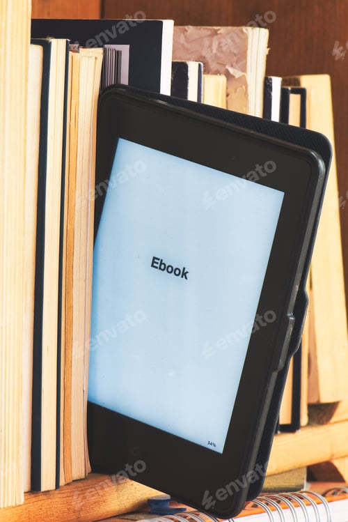 Preview: Detail of an e book reader among classic books