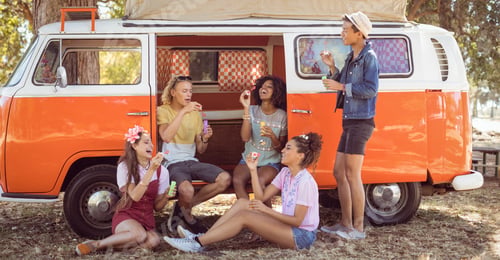 Preview: Happy friends enjoying at camper van