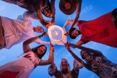 Preview: Group of friends lighting lanterns
