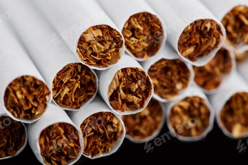 Preview: Cigarette Close Up Isolated On Blak Background. Drug Addiction. Tobacco Smoking. Cancer. Nicotine
