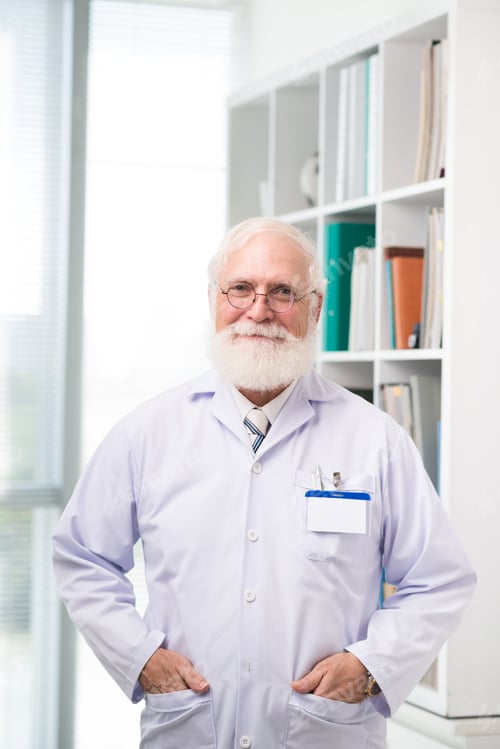 Senior Man in Lab Coat Posing Indoors