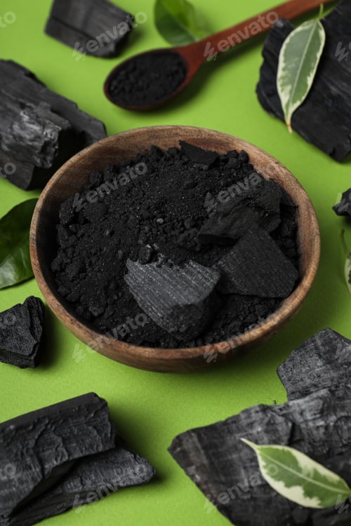 Preview: Natural wood or hardwood charcoal on green background