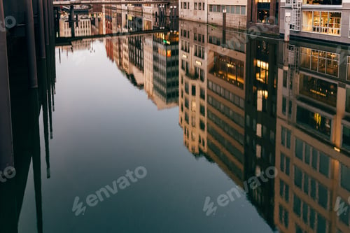 City Reflections on Canal Water in Evening Light