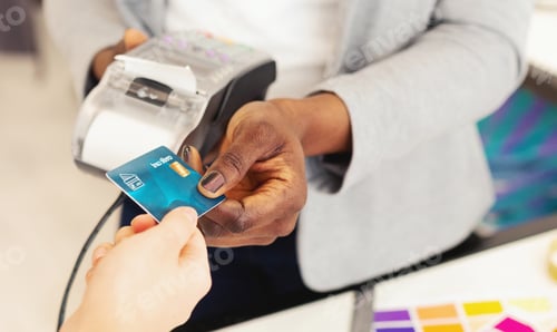Preview: African American Lady Holding Credit Card in Hand
