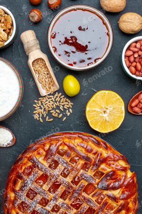 Preview: top view delicious fruity pie with nuts on dark background biscuit cookie nut pie cake dessert color