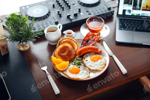 Preview: Breakfast pancakes, fried eggs, bacon, sausage and coffee.