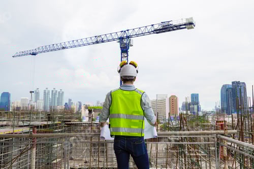 Preview: Portrait of an engineer designing a large project inspecting the job site to meet specifications.