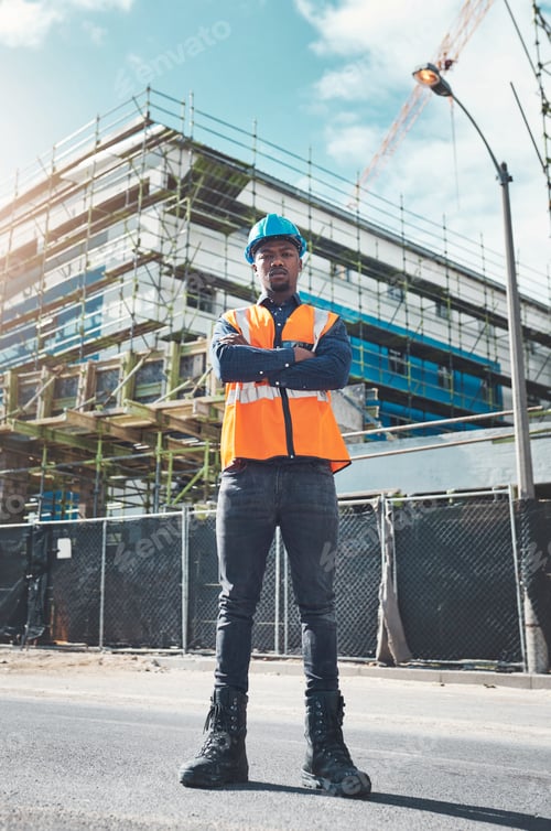 Preview: Portrait of a confident young man working at a construction site