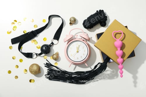 Preview: Sex toy with New Year's decor on a light background.