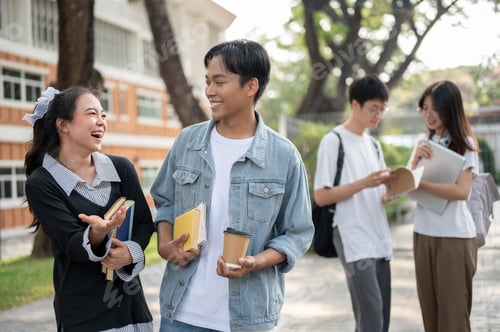 Preview: Young cheerful Asian female and male friends are enjoying talking, sharing fun stories outdoors.