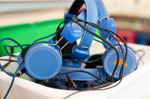 Preview: Bunch of headphones in a boy at school