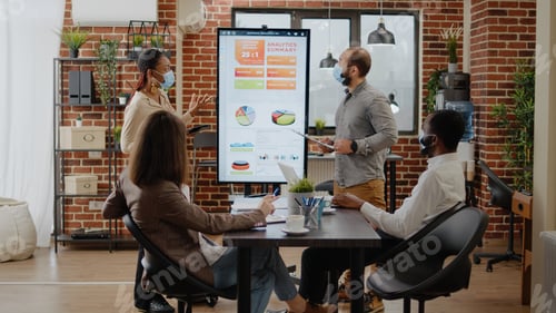 Preview: Team of multi ethnic workmates doing presentation in office