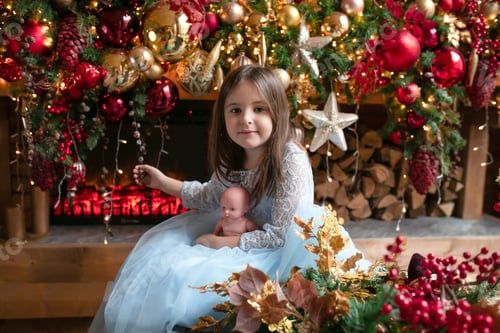 Preview: Girl Holds Doll in Front of Christmas Tree