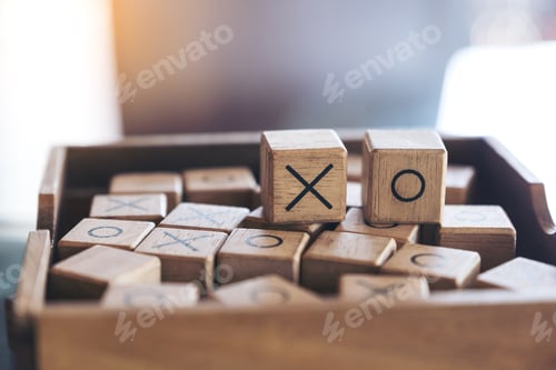Preview: Closeup image of wooden Tic Tac Toe game or OX game in a box